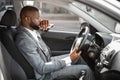 Pensive african american young businessman driving car Royalty Free Stock Photo