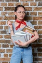 Pensive asian student holding books and pencil Royalty Free Stock Photo