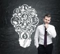 Pensive bearded man and big light bulb Royalty Free Stock Photo