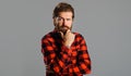 Pensive bearded man in plaid shirt. Thoughtful Handsome male. Solution of problem. Royalty Free Stock Photo