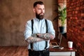 Portrait of bearded man with tattoes on his arms Royalty Free Stock Photo