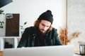 Pensive bearded student at college making universitet subjects