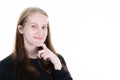 Pensive beautiful young woman smiling looking happy face cute smile posing in white copy space wall background Royalty Free Stock Photo