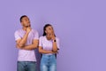 Pensive black couple looking aside at free copy space, thinking Royalty Free Stock Photo