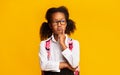 Pensive Black School Girl Thinking Posing In Studio, Yellow Background Royalty Free Stock Photo