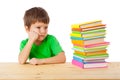 Pensive boy with stack of books Royalty Free Stock Photo