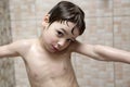 Pensive boy takes a shower Royalty Free Stock Photo