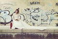 Pensive bride with a red suitcase Royalty Free Stock Photo