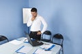 Pensive business man in meeting room Royalty Free Stock Photo