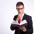 Pensive business man reading a book Royalty Free Stock Photo