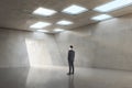 Pensive businessman in concrete office room interior standing at success door. Royalty Free Stock Photo