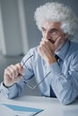 Pensive businessman with hand on chin Royalty Free Stock Photo