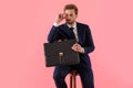 Pensive businessman holding a briefcase and hand on his forehead Royalty Free Stock Photo