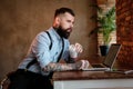 Portrait of bearded man with tattoes on his arms Royalty Free Stock Photo