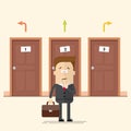 Pensive businessman or manager standing in front of the doors. Select a destination. A man in a business suit. Movement