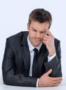 Pensive businessman sitting at the table Royalty Free Stock Photo