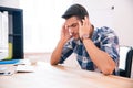 Pensive businessman sitting at the table Royalty Free Stock Photo