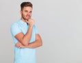Pensive casual man wearing a polo shirt with short sleeves Royalty Free Stock Photo