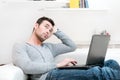 Pensive casual man working on laptop Royalty Free Stock Photo