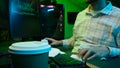 Pensive Caucasian man professional software engineer guy male coder programmer crypto specialist drinking coffee
