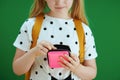 Pensive child counting pocket money isolated on green Royalty Free Stock Photo