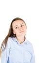 Pensive dreamy young woman looking up isolated on white wall background studio portrait Royalty Free Stock Photo