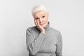 Pensive elderly woman with hand on cheek Royalty Free Stock Photo