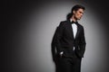 Pensive elegant man wearing tuxedo looks away to side Royalty Free Stock Photo