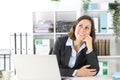 Pensive executive lady thinking looking up at office Royalty Free Stock Photo