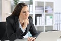 Pensive executive thinking looking away in the office Royalty Free Stock Photo