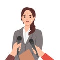 Pensive female politician thinking talking with reporters or journalists. Woman speaker have interview speak in microphones at