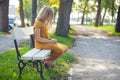 Pensive girl child alone in park Royalty Free Stock Photo