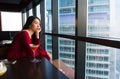 Pensive girl having a drink in a bar Royalty Free Stock Photo