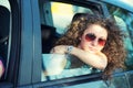 Pensive Girl Looking out of Car Window