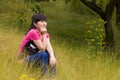 A pensive girl with weeds Royalty Free Stock Photo