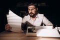 Pensive Handsome Bearded Writer Rereading His Texts Royalty Free Stock Photo