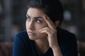 Pensive Indian woman look in distance thinking Royalty Free Stock Photo