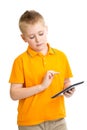 Pensive kid boy with tablet pc or phablet isolated Royalty Free Stock Photo