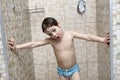 Pensive kid takes a shower Royalty Free Stock Photo