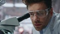 Pensive lab specialist working in genetics clinic closeup. Serious man scientist Royalty Free Stock Photo