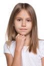 Pensive little girl against the white background