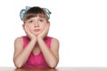 Pensive little girl at the desk Royalty Free Stock Photo