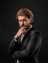 pensive look. fashionable man wear hand watch. formal fashion model. handsome man on gray background. serious bearded Royalty Free Stock Photo