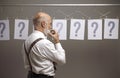 Pensive man comparing different possibilities and questions Royalty Free Stock Photo