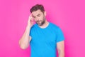 Pensive man isolated on studio background thinking. Thoughtful man planning problem solution, lost in thoughts consider Royalty Free Stock Photo