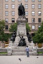 Pensive Man Looking up at Statue Royalty Free Stock Photo