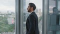 Pensive man standing office window close up. Businessman thinking about company. Royalty Free Stock Photo