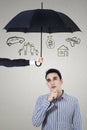 Pensive man under umbrella