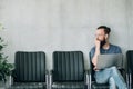 Pensive man waiting job interview sitting chair Royalty Free Stock Photo