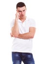 Pensive man in a white polo shirt Royalty Free Stock Photo